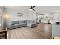 Open-concept living area with hardwood floors, neutral paint, and a seamless transition to the modern kitchen at 1110 Bent Willow Dr, Durham, NC 27704