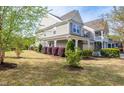 Beautiful two-story home with a covered porch and lush landscaping at 112 Red Admiral Ct, Hillsborough, NC 27278