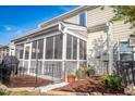 Covered porch with seating area, ideal for relaxing and enjoying the outdoors at 112 Red Admiral Ct, Hillsborough, NC 27278