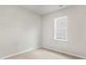 Neutral bedroom featuring plush carpeting and a bright window, perfect for relaxation at 128 Pisgah St, Sanford, NC 27330