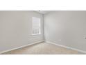 Cozy bedroom featuring plush carpeting and a bright window offering natural light at 128 Pisgah St, Sanford, NC 27330