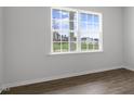 Bedroom with a large window providing ample natural light and views of the outdoors at 129 Pisgah St, Sanford, NC 27330