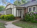 Charming home entrance with a covered porch, lush greenery, and well-defined street address at 1304 Deboy St, Raleigh, NC 27606