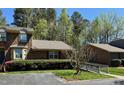 Lovely exterior showcasing brick accents, lush greenery, and a convenient wheelchair ramp at 1308 Oakridge Ave # 3, Henderson, NC 27536