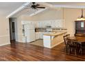 Bright, open kitchen with white cabinets, adjacent dining area, and hardwood floors at 1308 Oakridge Ave # 3, Henderson, NC 27536