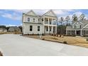 Charming two-story home with a long driveway and beautifully landscaped yard at 25 Long Needle Ct # 37, Youngsville, NC 27596