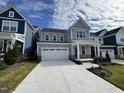 Beautiful two-story home with a manicured lawn, and a spacious, well-maintained driveway at 316 Catheys Creek Cir, Wendell, NC 27591