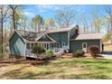 This home has a spacious backyard with a deck, perfect for outdoor entertaining and relaxation at 3418 Carriage Trl, Hillsborough, NC 27278