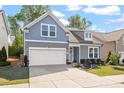Charming two-story home featuring a two-car garage, manicured lawn, and tasteful landscaping at 356 Avery Glenn Way, Fuquay Varina, NC 27526
