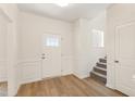 Bright foyer with wood floors and white trim, showcasing a welcoming entrance at 40 Rosewood Ln, Youngsville, NC 27596
