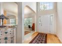 Bright foyer with hardwood floors, high ceilings, and elegant arched doorways at 401 Stinhurst Dr, Durham, NC 27713