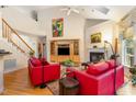 Spacious living room with fireplace, hardwood floors, and abundant natural light at 401 Stinhurst Dr, Durham, NC 27713