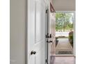 View of the open front door that leads to a walkway with greenery on either side at 41 Willow Green Dr, Clayton, NC 27527