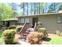 Inviting exterior featuring a quaint entrance with a wooden porch at 502 W Poplar Ave # C2, Carrboro, NC 27510