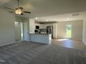 Open-concept living room and kitchen boasts natural light, modern fixtures and finishes at 70 Pate Landing Dr, Selma, NC 27576