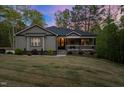 Charming home featuring manicured landscaping and a welcoming front porch, perfect for enjoying evenings at 775 Sagamore Dr, Louisburg, NC 27549