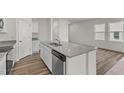 Gourmet kitchen featuring an island, granite countertops, and stainless steel appliances at 833 Kenyon Spring Dr, Zebulon, NC 27597