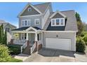 Charming two-story home with a covered front porch and attached two-car garage at 904 Coral Bell Dr, Wake Forest, NC 27587