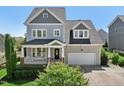 Charming two-story home with a covered front porch and attached two-car garage at 904 Coral Bell Dr, Wake Forest, NC 27587