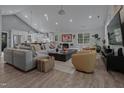 Spacious living room featuring hardwood floors, modern decor, and abundant natural light at 1001 Manchester Dr, Raleigh, NC 27609