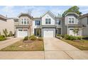 Inviting townhome exterior features a garage, landscaping, and a well-maintained lawn for curb appeal at 1020 Sycaten St, Durham, NC 27703
