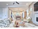 Cozy living room featuring hardwood floors, modern ceiling fan, and an open layout connecting the living space with the kitchen at 107 Hillcrest Ave # C And D, Carrboro, NC 27510