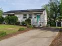 Inviting single-story home with a private driveway, small garden, and a detached storage shed in the backyard at 1116 Holburn Pl, Raleigh, NC 27610