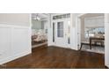 Spacious foyer with hardwood floors transitioning to a dining room and office space for versatile living at 1203 Great Egret Way, Durham, NC 27713