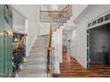 Inviting foyer with a staircase featuring a wood banister and wrought iron spindles at 1216 Caribou Xing, Durham, NC 27713