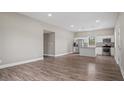 Bright and spacious living room showcasing modern flooring and an open layout to the kitchen at 1284 Railroad St, Henderson, NC 27536