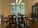 Formal dining room featuring beautiful hardwood floors and large windows with natural light at 1425 Bascomb Dr, Raleigh, NC 27614