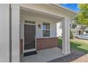 Inviting covered porch with classic columns and a stylish front door at 145 Ryder Cup Cir, Raleigh, NC 27603