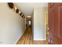 Welcoming entryway with hardwood floors and neutral-colored walls at 216 Harvester Dr, Holly Springs, NC 27540