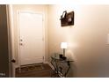 Bright entryway featuring a white door, decorative table, and charming accents at 26 Stonewall Way, Durham, NC 27704