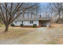 Inviting single story home with covered parking and a gravel driveway at 2670 Turner Rd, Mebane, NC 27302