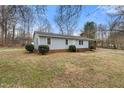Charming single story house with a brick foundation and well-manicured shrubbery at 2670 Turner Rd, Mebane, NC 27302