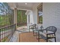 Inviting front porch featuring comfortable seating, perfect for relaxing and enjoying the peaceful surroundings at 30 Mist Wood Ct, Pittsboro, NC 27312