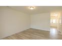 A spacious living room featuring hardwood floors and ample natural light at 3007 Cypress Lagoon Ct, Durham, NC 27703