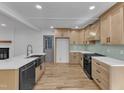 Modern kitchen features sleek countertops, stainless steel appliances, and light wood cabinetry at 3100 Greenville Loop Rd, Wake Forest, NC 27587