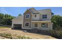 Newly built, two-story home with an attached garage, awaiting final touches at 317 Hampshire Court, Four Oaks, NC 27524