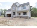 Beautiful two-story home with a two-car garage, a welcoming front porch, and meticulous detailing at 317 Hampshire Court, Four Oaks, NC 27524