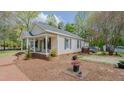 Inviting exterior with a quaint front porch and a side deck perfect for entertaining or relaxing at 322 W Hill N Ave, Hillsborough, NC 27278