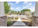 View from the front door showing the walkway, landscaping, and community green space at 379 Tobacco Farm Way, Chapel Hill, NC 27516