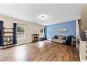 Spacious living room with hardwood floors and a stone fireplace at 4228 Nc 42 Hwy, Raleigh, NC 27603
