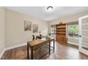 Bright home office with hardwood floors, custom built in bookcase, and natural light at 4228 Nc 42 Hwy, Raleigh, NC 27603