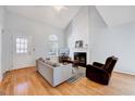 Inviting living area boasts hardwood floors, a stylish fireplace, and lots of natural light at 5016 Silhouette Dr, Durham, NC 27713