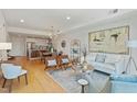 Open concept living area with modern decor, dining space, and hardwood flooring at 523 S West St # 404, Raleigh, NC 27601