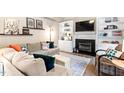 Cozy living room boasting a fireplace, built-in shelving, and comfortable seating for relaxing and entertaining at 5911 Mountain Island Dr, Durham, NC 27713