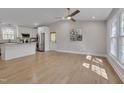 Bright and airy living room flows into a modern kitchen with stainless appliances at 6105 Bellow St, Raleigh, NC 27609