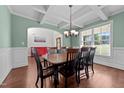 Elegant dining room with coffered ceilings, a wooden table, and abundant natural light at 64 Thousand Oaks Ct, Clayton, NC 27527